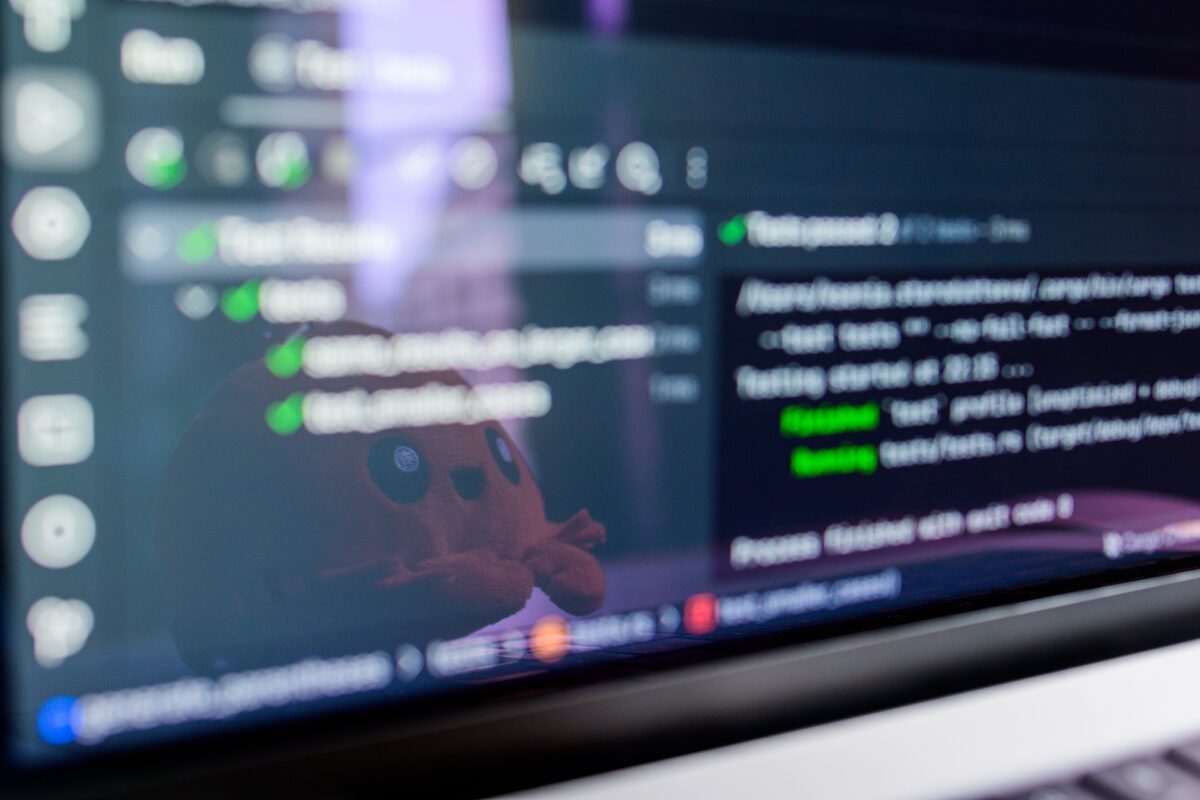 Code reflected in a laptop screen